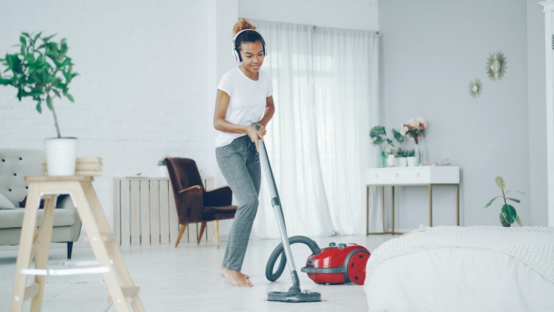 person vacuuming living room